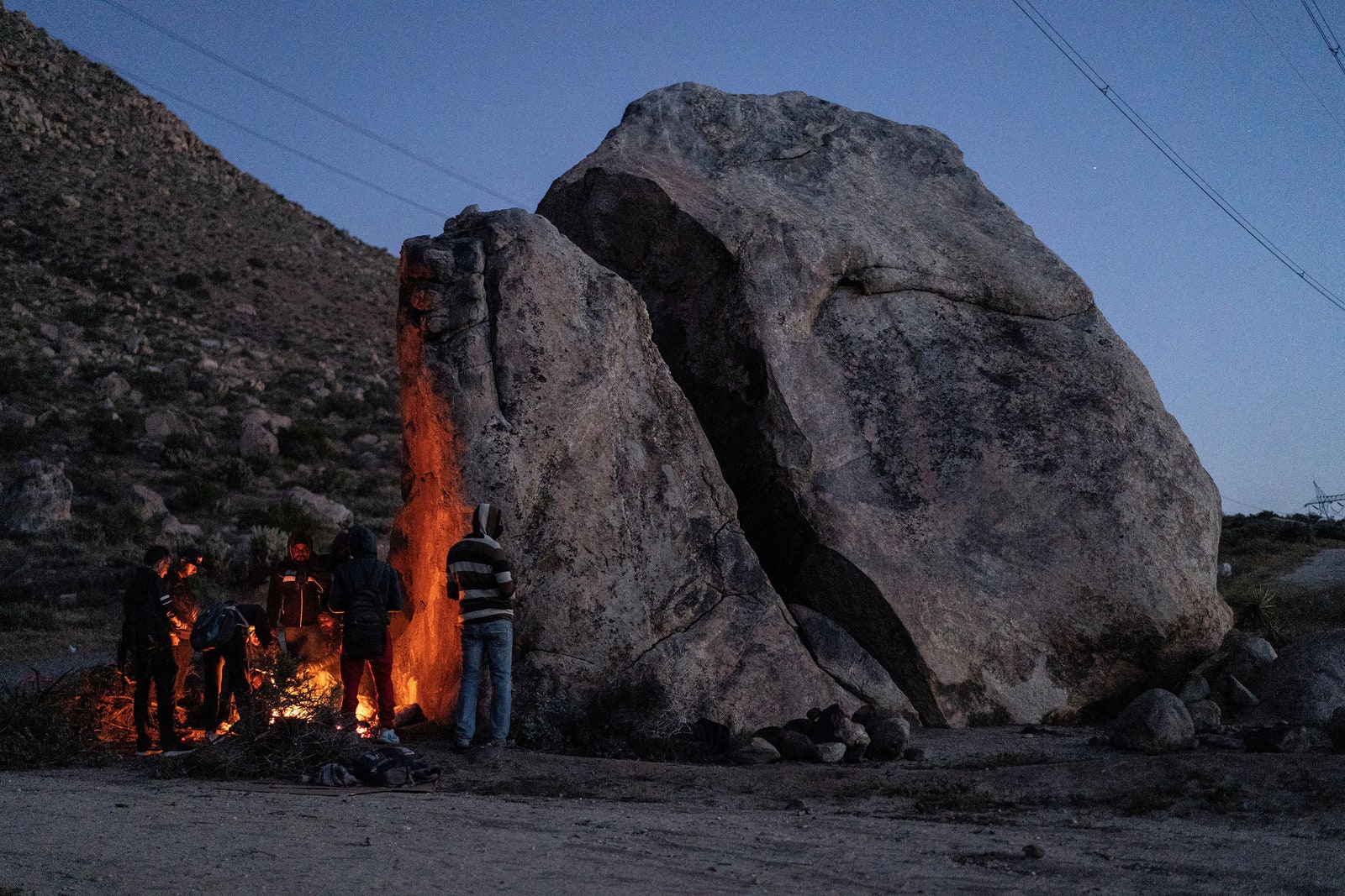 Image may contain Rock Fire Flame Person Outdoors Nature and Mountain